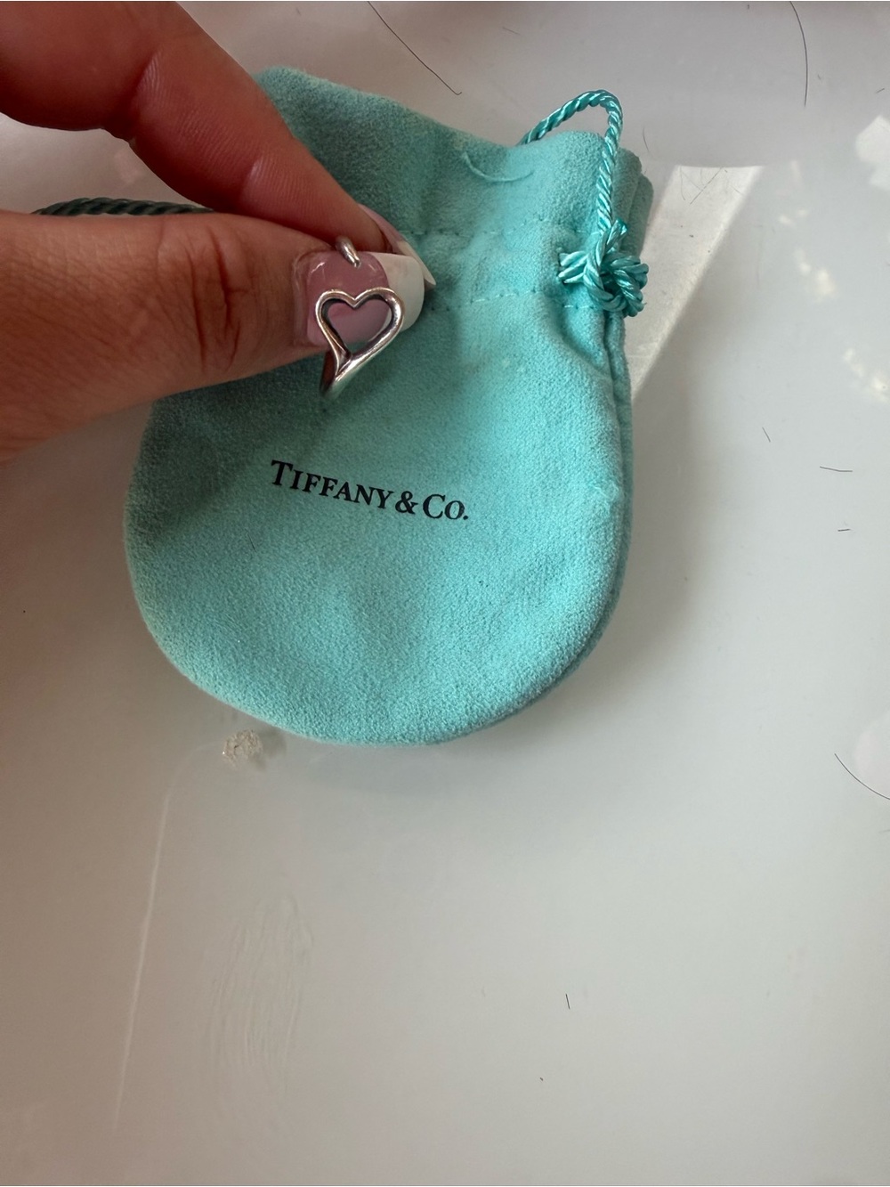 Tiffany heart charm on pouch